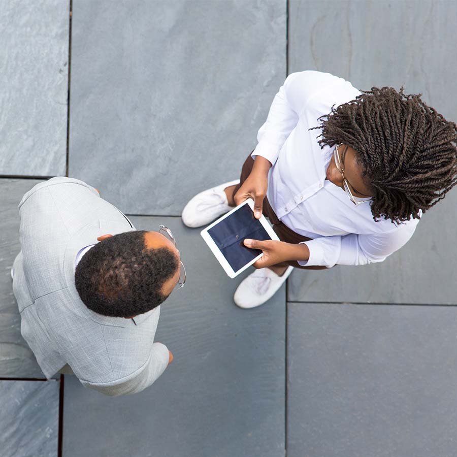 An overhead shot of two people at an event together, collaborating