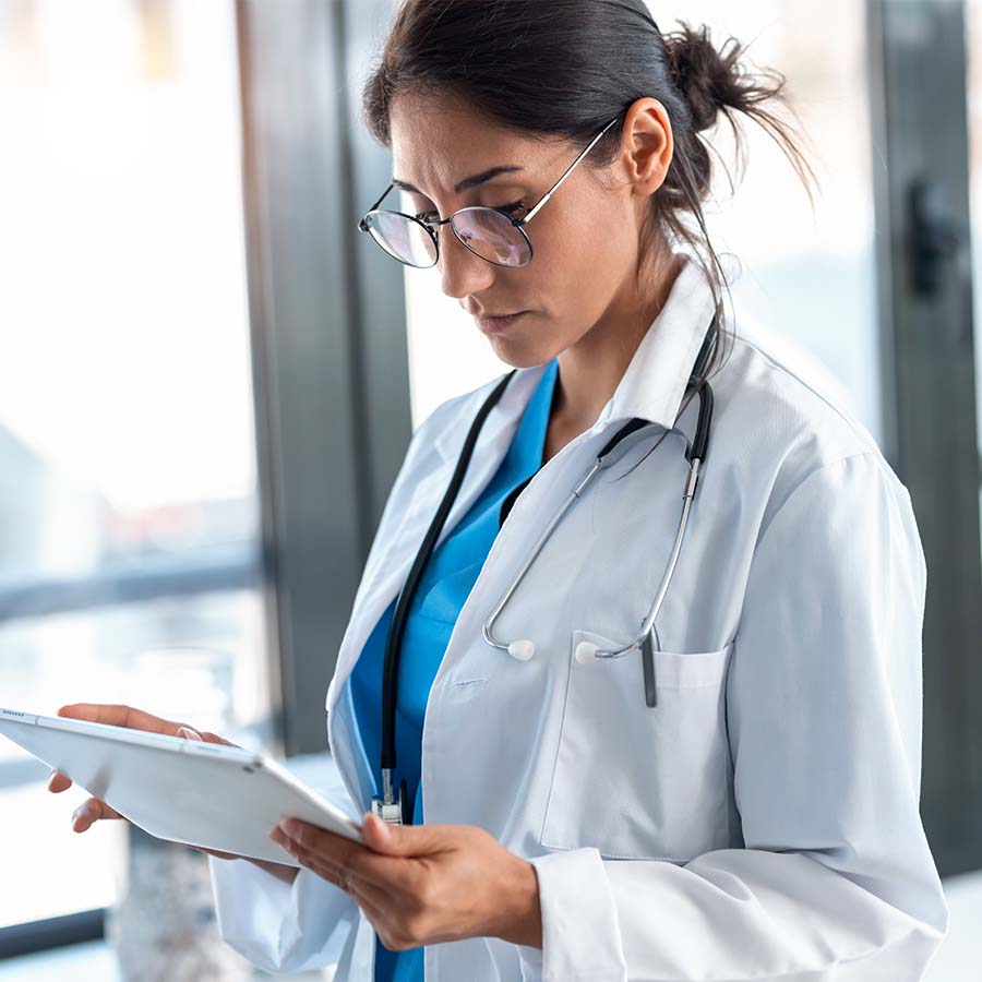 A doctor using a tablet