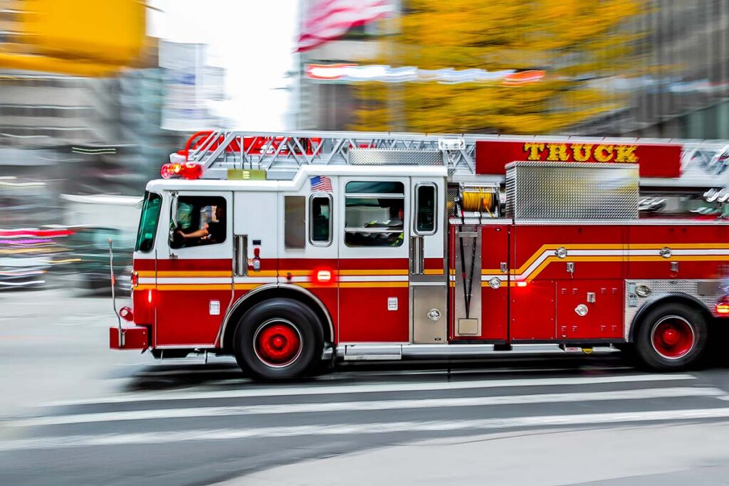 Firetruck driving down a street